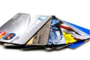 Six credit cards fanned out on a white background.